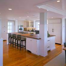 The kitchen also has a large kitchen island used mainly as additional preparation space and a casual dining area, allowing space for 4 cherry wood bar stools. Kitchen Islands With Columns An Ideabook By Anna Ochoa