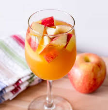 One of my favorite caramel vodka recipes to celebrate fall sweet spiced apple cider mixed with caramel flavored vodka, shaken over ice and served with a slice of sweet apple as a garnish! Caramel Apple Sangria The Wholesome Dish