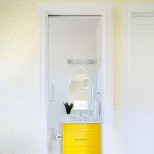The next thing to do is placing the vase on the bathroom vanity, and the guests will spot the stunning view. Yellow Bathroom Wallpaper Design Ideas