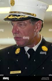 New York Fire Department Chief of Department Frank Cruthers listens to a  question from a member of the press shortly after being sworn into office  by Fire Commissioner Nicholas Scoppetta, in the