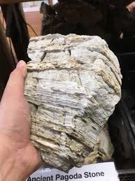 The texture found on elephant skin stone is the caused by years of weathering and natural erosion, resulting in a leathered, wrinkled appearance. Aquascaping Stones Ancient Pagoda Stone