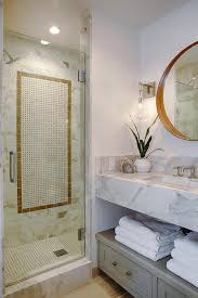 Cool, neutral stone and gold accents give a soft, romantic feel, adding timeless elegance to space. Gold Marble Border Tiles Design Ideas