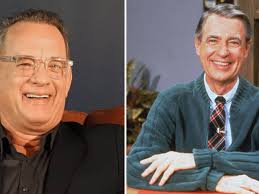 Watch Tom Hanks sing and play the piano in the 'A Beautiful Day in the...