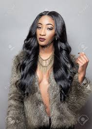 They also develop spots like any dalmatian. Beautiful Black Woman With Long Curly Hair Wearing A Fur Coat Stock Photo Picture And Royalty Free Image Image 26080827