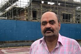 &#39;SITE IS AWFUL&#39;: Suneel Sharma. Building work on an unfinished block of flats labelled an eyesore by neighbours will not restart until the economy picks up. - C_71_article_1463705_image_list_image_list_item_0_image