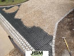 Sounds like your gravel is sinking thru the soil. New Gravel Driveway In Northampton