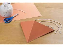 Crease a square piece of paper diagonally from each corner. How To Make A Construction Paper Beak Bird Costume How To Make A Bird Beak Beak Mask Diy