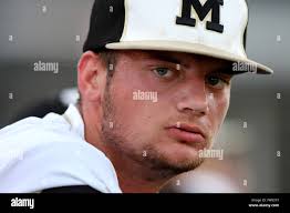 New Port Richey, Florida, USA. 31st Mar, 2016. DOUGLAS R. CLIFFORD.Mitchell  High School pitcher Tyler Edling (23) takes a rest in the dugout during the  third inning of Thursday's (3/31/16) game with
