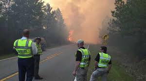 Fire 100% contained, man charged with accidentally starting it