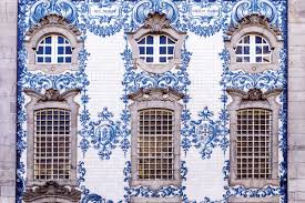 These tiles were cast from the tops of old guardrail posts and arranged into a wall mosaic.learn more about the process: Ceramic Tile History Traditional Building