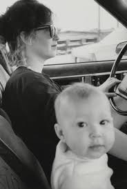 Gregory Corso, his attic room 9 Rue Gît-le-Coeur, wooden angel hung from  wall right, window looked