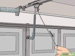 The capacitor is a white cylindrical piece that works a little bit like a. Easy Ways To Adjust Garage Door Cables 9 Steps With Pictures