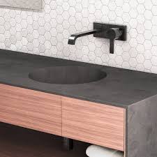 It's small enough to harmonize with the room but interesting enough visually to bring a sense of movement to the space. Basin Corian