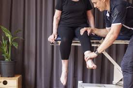 Senior patient performing knee-strengthening exercises