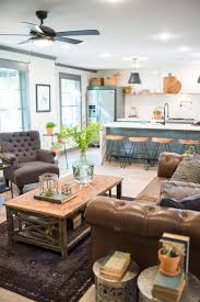 She created two defined spaces using light fixt. Fixer Upper Season 3 Episode 8 The School House Fixer Upper Living Room Farm House Living Room Farmhouse Style Kitchen