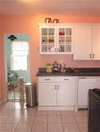 The kitchen features an intricate tile backsplash sandwiched between layers of. Peach Colored Kitchen Decor Theedlos Kitchen Decor Kitchen Remodel Kitchen