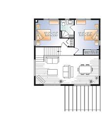 The generous kitchen and living area features a vaulted ceiling and a fireplace that adds to the overall ambiance. What Is The Cheapest Type Of House To Build Blog Floorplans Com