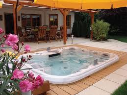 Pool and hot tub with table. Backyard