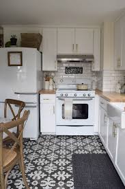 White Kitchen Remodel With Patterned Tile And Butcher Block Counter Tops Retro Oven An Retro Kitchen Appliances Kitchen Remodel Small White Kitchen Remodeling
