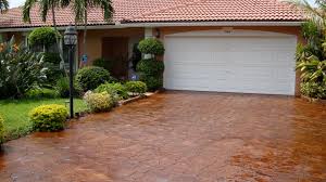 You may not want just a plain driveway, such as asphalt, and with stamped concrete you can create some patterns in the driveway.this would be less expensive than an all paver driveway, for example. Acid Staining Stamped Concrete