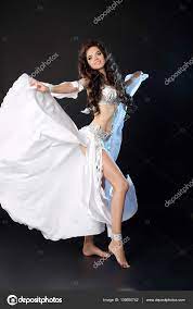 Bellydance. Beautiful Arabic sexy belly dancer in blowing white Stock Photo  by ©VictoriaAndrea 136650742