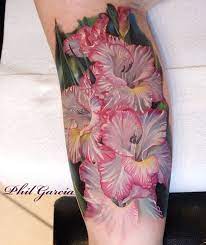 Realistic Gladiolus Pretty White Flowers With Pink Frills Tattooed By Phil Garcia An Artis Realistic Flower Tattoo Gladiolus Flower Tattoos Gladiolus Tattoo