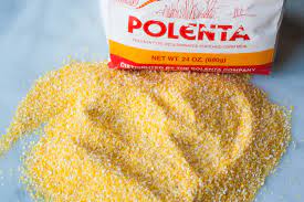 Raw ground corn used to make polenta (selective focus, focus on the top of the ground corn pile). What S The Difference Between Cornmeal And Polenta Kitchn
