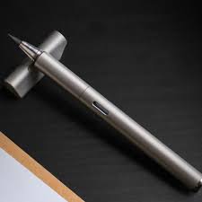 This Titanium Calligraphy Pen Trades Tactical Utility for Softer ...