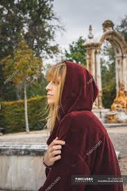 Robinhood's (hood) ipo journey looks complete. Side View Of Brunette Girl In Red Hood Posing Over Arch Statue On Background Woman Peace Stock Photo 176672158