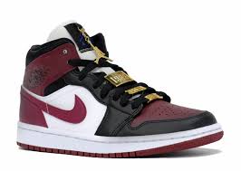 The decorative pieces take the form of a gold jumpman pendant and various matching gold lace jewels, including the familiar wings logo and rectangular plates stamped with '1985' and 'women.' Air Jordan 1 Mid Fearless Maroon W Level Up