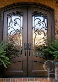 Double doors are also refered to as french doors and are available in various styles, wood species and prices to fit any budget and home style. Iron Double Doors Custom Front Entry Doors Clark Hall Doors Wrought Iron Front Door Iron Front Door Front Door Design