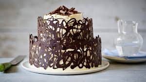 Sandwich the cakes together with a thin layer of frosting and then spread the remains over the top and sides of the cake. Three Tier Red Velvet Cake Recipe Bbc Food