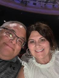 ✨ Confident, stylish, and ready for anything! ✨ Jill looks stunning in this  henley-style top paired with our sleek Joseph Ribkoff Skirt — the perfect  combo for a refined, modern look. 💕