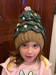 My little friend looks so festive in the Christmas Tree Hat that I made her.