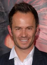 Biographies: Greg Ellis