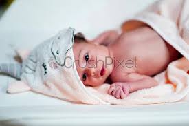 Drying and dressing your newborn after a bath: Baby Happy After Hot Foam Bath Stock Photo Crushpixel