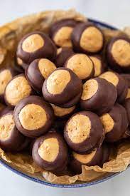 Peanut butter oreo truffles dipped in a peanut butter coating and milk chocolate! Buckeye Candy Easy Chocolate Peanut Butter Balls Casserole Crissy