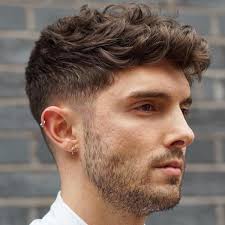 Dark Blonde Curly Taper Fade Haircuts For Guys In 2020 Mens Haircuts Fade Wavy Hair Men Mens Hairstyles Thick Hair