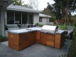 Love The Wood Cabinets For The Outdoor Kitchen Where Can I Get Them What Type Of Wood Are Outdoor Kitchen Outdoor Kitchen Design Outdoor Kitchen Countertops