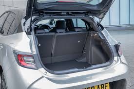 While the rear seats do fold down, there is a large lip between the bottom of the trunk floor and folded seats, making it hard to load long items. Toyota Corolla Hybrid Practicality Boot Space Drivingelectric