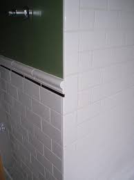 Gray marble subway shower surround tile s are accented with gray marble chair rail tile s and finished with a chrome shower kit. Subway Tile With Chair Rail And Vertical Bullnose Bathroom Remodel Small Shower Chair Rail Shower Remodel
