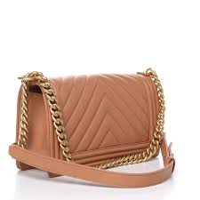 Created by karl lagerfeld this design owns the name of gabrielle chanel's first love, boy capel. Chanel Calfskin Chevron Quilted Medium Boy Flap Camel 488290 Fashionphile