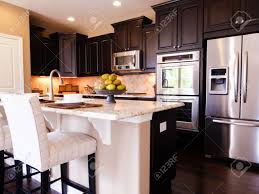Modern Kitchen With Dark Wood Cabinets And Hardwood Floors Stock Photo Picture And Royalty Free Image Image 15079365