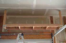 Diy How To Build Suspended Garage Shelves In 2021 Garage Storage Shelves Diy Overhead Garage Storage Garage Ceiling Storage