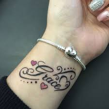 Wrist Birth Year Tattoo Designs Grace Wrist Tattoo Designs Tattoos On Pinterest October Birth Flowers Wrist Tattoos For Women Tattoos For Daughters Name Tattoos On Wrist