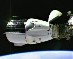 Dragon is seen against the earth's atmosphere. Spacex S Crew Dragon Spaceship Links Up With Space Station For First Time Geekwire