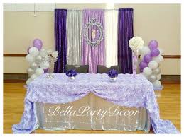 The decor uses vibrant colors and flowers to this baby shower uses purple. Vintage Baby Baby Shower It S A Girl Purple And Silver Main Table Wth Backdr Baby Girl Shower Themes Vintage Baby Girl Shower Themes Baby Shower Favors Diy