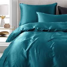Featuring jungle green, teal, and blue monstera leaves sheltering a big cat covered with rosettes in brown, black, and tan, and embossed with ultrasonic quilting in a palm frond motif, the jungle cat bedding set reverses to a solid color teal. Amazon Com Vonty 3 Pieces Satin Duvet Cover Set King Size Teal Silk Like Satin Bedding Set With Zipper Closure 1 Duvet Cover 2 Pillowcases Kitchen Dining
