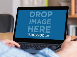 Placeit Young Man At Work On Black Samsung Laptop Mockup Template Mockup Template Samsung Laptop Mockup