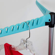 With a push of a button, you expand the rack and create a spacious place for drying clothes inside. Sunbeam Collapsible Tripod Clothes Drying Rack Blue Drying Shop Home Basics Hds Trading Wholesale Site